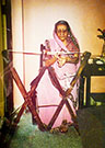 Mrs. Najamai M. Kotwal weaving a kustīg, Mumbai, 1990. (Photograph courtesy of F. M. Kotwal)